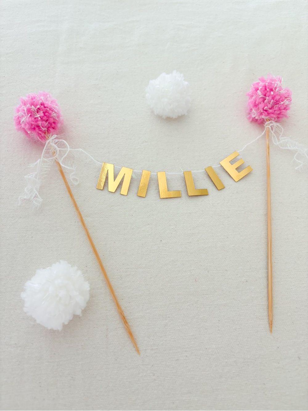 Personalized Gold Cake Topper with Pink and White Pom-Poms